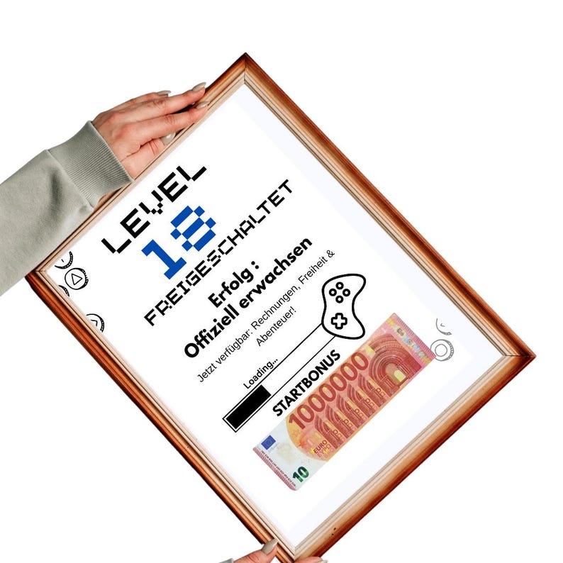 May include: A framed print with a brown wooden frame. The print features the text "LEVEL 18 FREIGESCHALTET" in black and blue pixelated font. Below, it reads "Erfolg: Offiziell erwachsen" and includes a graphic of a game controller and a 10 Euro note.