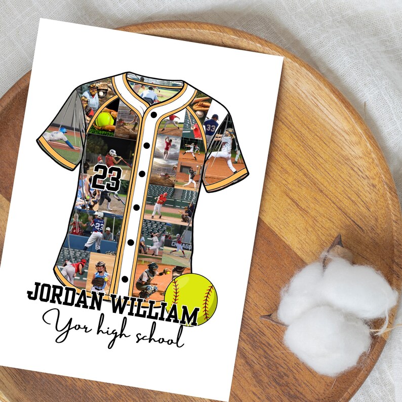 May include: A white print featuring a baseball jersey design with a collage of photos. The jersey has the number 23 and the name "JORDAN WILLIAM" with the text "Your high school" below it. A yellow softball is also included.