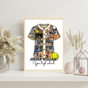 May include: A framed baseball jersey collage with the name "JORDAN WILLIAM" and the text "Your high school". The jersey is white, black, and gold, with the number 23. A yellow baseball is also featured.