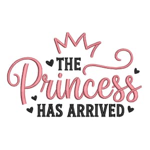 May include: A pink and black embroidered design on a white background. The text reads "The Princess Has Arrived" in a script font, with a crown above and hearts around the text. The design is likely for a baby or child.