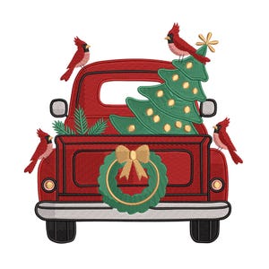 May include: Embroidered design of a red pickup truck carrying a green Christmas tree, a wreath, and four red cardinals. The truck has black tires and a silver bumper. The wreath has a gold bow.