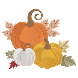May include: An embroidered design featuring three pumpkins in shades of orange, white, and yellow, with brown stems. The pumpkins are surrounded by fall-coloured leaves in shades of brown, green, and red, creating a seasonal autumn theme.