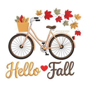May include: A tan bicycle with a basket filled with autumn leaves. Red, yellow, and green leaves are scattered around the bike. The words "Hello Fall" are written in gold and brown script with a red heart.