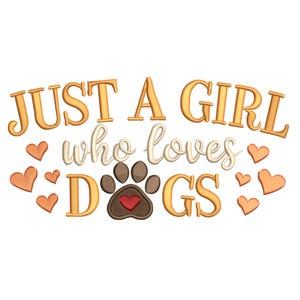 May include: Embroidered design with the text "JUST A GIRL who loves DOGS" in gold and white. A brown paw print with a red heart is centered below the text. Small orange hearts are scattered around the text.