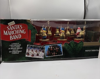 Banda de música vintage de Mr. Christmas Santa's Marching Band de 1992, completa y en perfecto estado de funcionamiento, en su caja original.