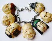 Vintage 40s Toshikane Japanese Carved Faces Seven Lucky Gods of Fortune Charm Bracelet