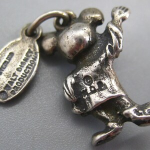 May include: A set of three ceramic mugs with a speckled, matte finish. The mugs are in shades of cream, light gray, and dark gray. Each mug has a simple, minimalist design and a rounded handle. The mugs are stacked on top of each other.