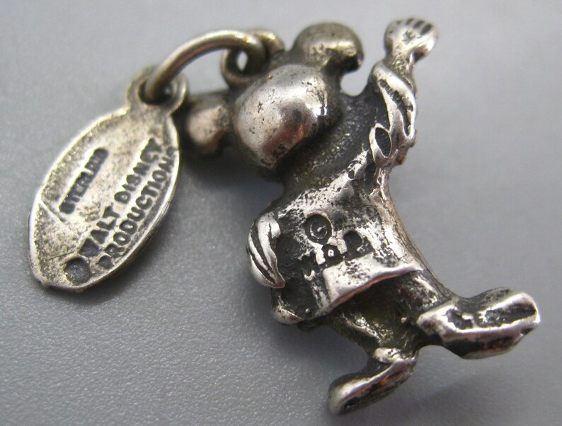 May include: A set of three ceramic mugs with a speckled, matte finish. The mugs are in shades of cream, light gray, and dark gray. Each mug has a simple, minimalist design and a rounded handle. The mugs are stacked on top of each other.