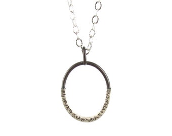 Small Sterling Silver Oval Pendant with Black Accents