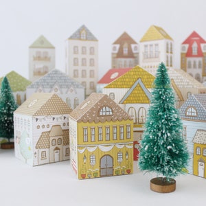 Paper houses with advent calendar treats inside