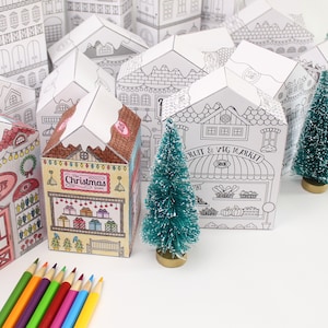 Printable advent calendar set: a couple Christmas houses already coloured next to some not yet coloured