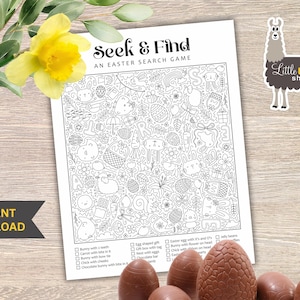 May include: A black and white Easter seek and find game with the text "Seek & Find" and "An Easter Search Game". The game features various Easter-related illustrations. A "Little Llama Shoppe" sticker is visible. Chocolate Easter eggs are in the foreground.