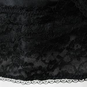 May include: Black lace trim with a white scalloped edge. The lace has a floral pattern.