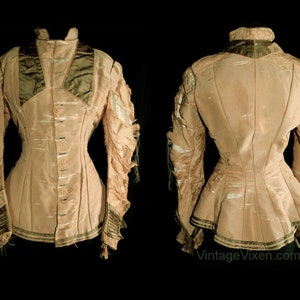 May include: A vintage light pink jacket with a high collar and long sleeves. The jacket features a fitted waist, decorative trim, and a row of buttons down the front. The sleeves have a unique, layered design. The jacket is displayed against a black background.