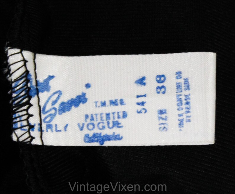 May include: White tag with blue text that reads "Patented Vogue" and "T.M.N.E."  The tag also has the numbers "541 A" and "38" with the word "Size" above the number 38. The tag also has the text "Made in Country of  Reverse Side."