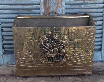 vintage brass magazine rack embossed old world scene wooden interior