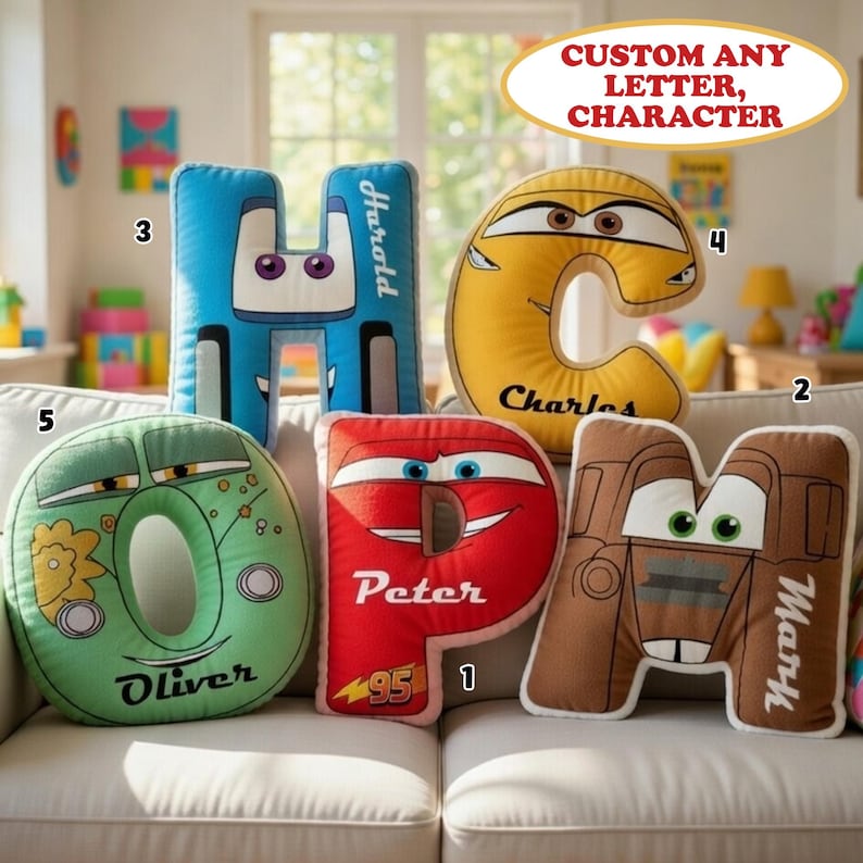 May include: Five plush letter-shaped pillows featuring cartoon car designs with eyes and names printed on them. The pillows are shaped like the letters H, C, O, P, and M, colored blue, yellow, green, red, and brown, with the names Harold, Charles, Oliver, Peter, and Mark.