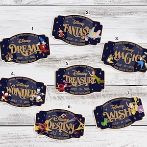May include: A collection of seven navy blue Disney-themed stickers. Each sticker features a different word: Dream, Fantasy, Magic, Wonder, Treasure, Destiny, and Wish. Each sticker includes the text "July 15-2025" and "The Smith Family."