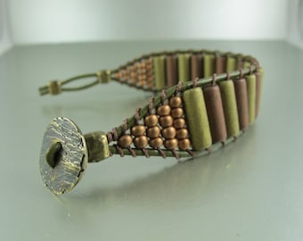 Handwoven Ladder Bracelet, Metallic Ceramic Beads, Gold and Copper Tubes, Seed Beads, Olive Greek Leather Cord, 3/4 inches wide