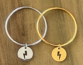 bracelet jonc breloque éclair en acier inoxydable au choix