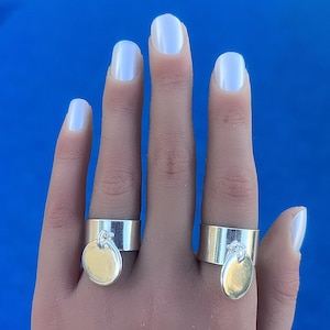 Adjustable medal tassel charm rings in 10 micron silver plate