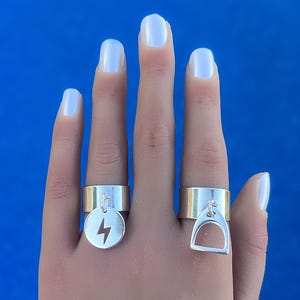 Adjustable 10 micron silver plated lightning or stirrup charm rings