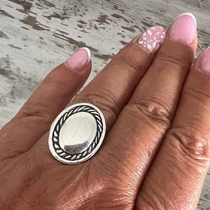 Adjustable oval ring in aged 12 micron silver plate