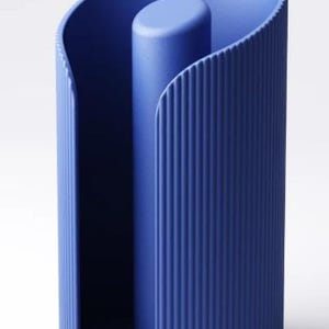 May include: A modern, blue cylindrical object with a central column and curved, ribbed sides. The design features a solid base and a smooth, rounded top, creating a minimalist aesthetic. The object is approximately 25 cm tall.