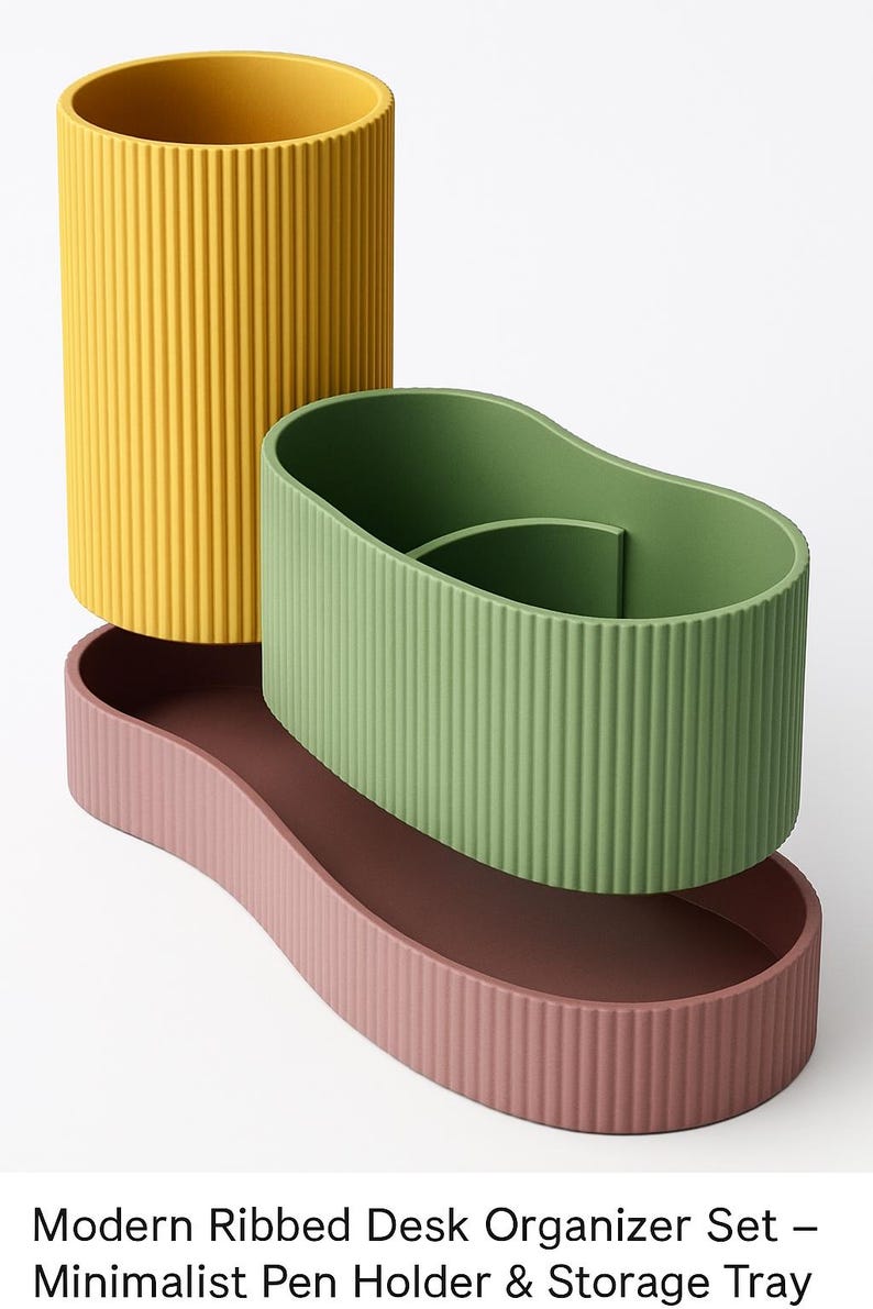May include: A modern desk organizer set with a minimalist design. The set includes a yellow cylindrical pen holder, a green oval-shaped pen holder, and a pink storage tray. All pieces have a ribbed texture.