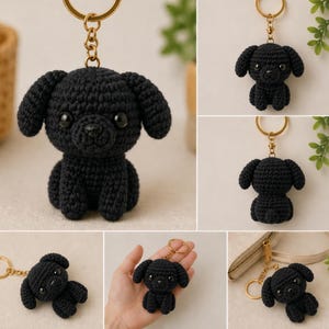 May include: A collection of black crochet dog keychains. Each keychain features a small, detailed dog with floppy ears, a round body, and a gold-colored keyring. The dogs are handmade and have button eyes and a small nose.