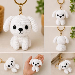 May include: White crochet dog keychain with black eyes and nose, attached to a gold-colored keyring. The dog has floppy ears and is sitting upright. The image shows multiple views of the keychain.