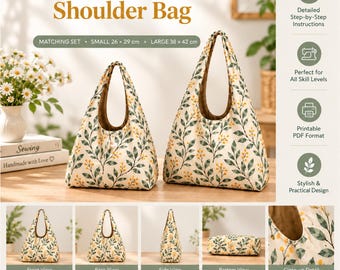 May include: A set of two hobo shoulder bags in a cream fabric with a green leaf and yellow berry pattern. The small bag measures 26 by 29 cm and the large bag measures 38 by 42 cm. The bags feature a brown interior lining and a single handle.