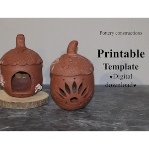 May include: Two terracotta-colored ceramic acorn-shaped candle holders. One has a small window and floral accents, the other has a sunburst design. The image includes the text "Pottery constructions" and "Printable Template Digital download".