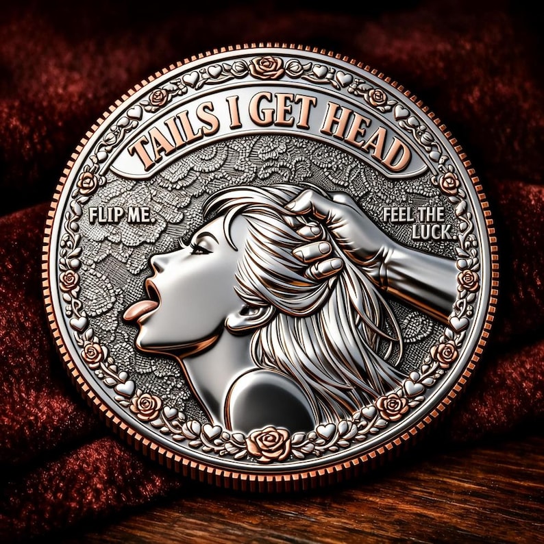 May include: A silver and copper coin with the text "TAILS I GET HEAD" and "FLIP ME." The coin features a woman's profile with her tongue out and a hand holding her hair. The words "FEEL THE LUCK" are also on the coin.
