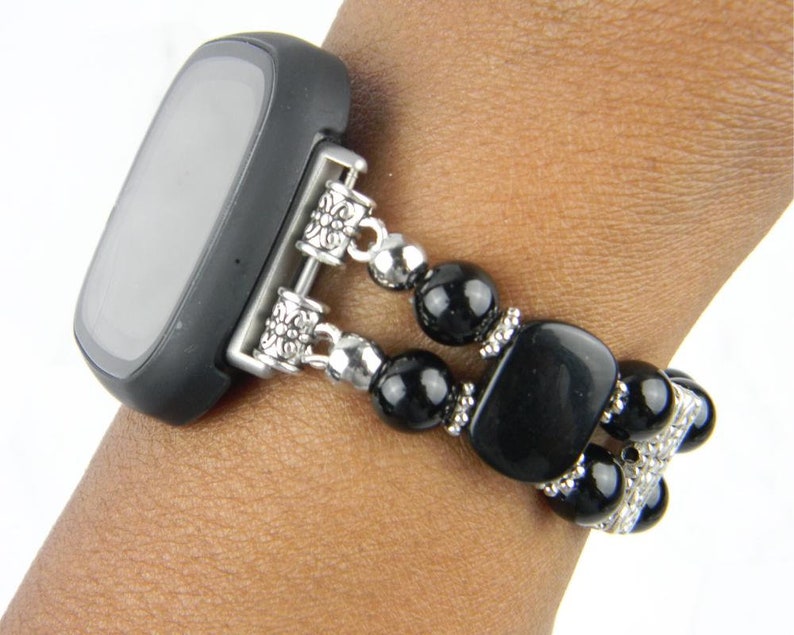 beaded watch band for fitbit versa 3 or 4. band is black onyx round beads, antique silver spacer bars and black obsidian spacer bars.
