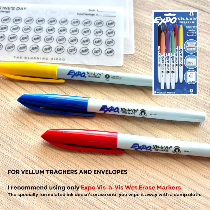 May include: Three Expo Vis-&agrave;-Vis wet erase markers in yellow, blue, and red, featuring white barrels with matching colored caps and clips. The markers are displayed alongside a packaging card showing eight markers and a vellum savings tracker sheet.