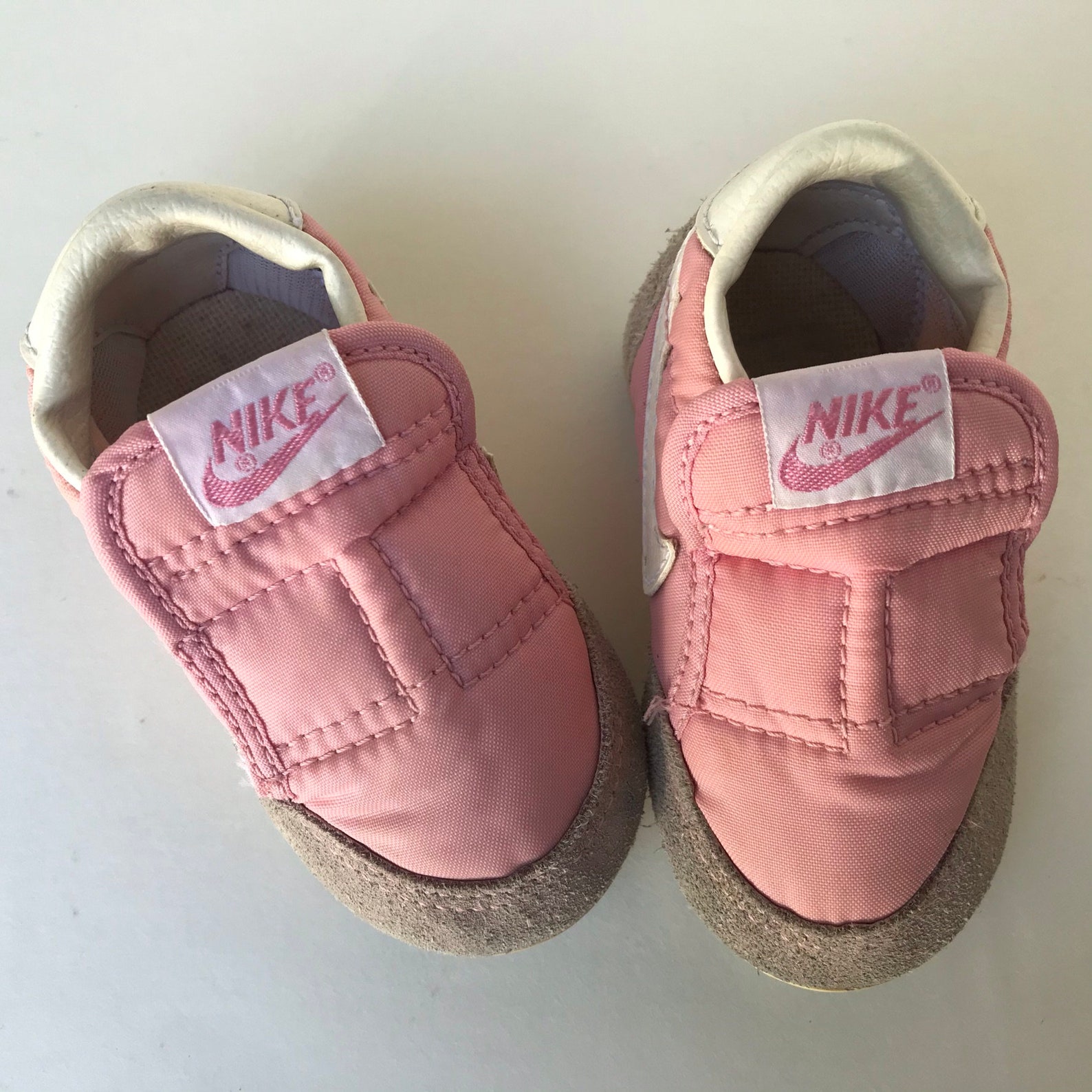 pink nikes with jelly bottoms