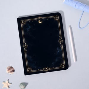 May include: A rectangular notebook with a dark navy blue cover featuring a celestial theme. The cover displays a gold-colored border with intricate star and crescent moon motifs surrounding a deep, cloudy night sky illustration.