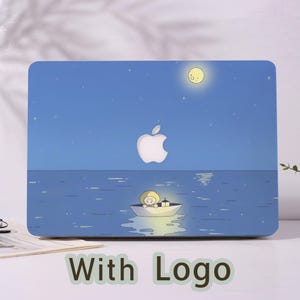 May include: A blue laptop case featuring a cartoon illustration of a person in a boat on the water under a starry night sky with a full moon. The Apple logo is centered. The words "With Logo" are at the bottom.