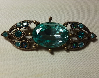 Vintage art-decostijl broche met enorme ovale blauwe strassteen, goudkleur
