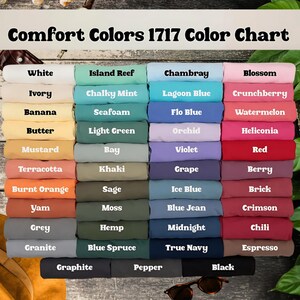 May include: A color chart titled "Comfort Colors 1717 Color Chart" displays a variety of fabric swatches in various colors. Colors include white, ivory, banana, butter, mustard, terracotta, burnt orange, yam, grey, and granite.