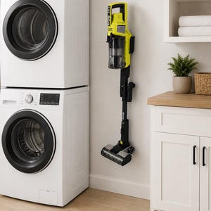 May include: A lime green and black cordless stick vacuum cleaner mounted vertically on a wall. The vacuum features a clear dust canister, a long black extension tube, and a motorised floor head. The text Made In The USA is printed below.