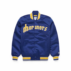 May include: A blue satin jacket with the word "Mariners" in yellow script across the chest. The jacket has a yellow collar, cuffs, and waistband trim. The jacket is buttoned up and has a Starter logo on the sleeve.