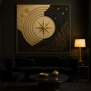 May include: A large, square wall art piece with a gold compass design against a black and beige background. The artwork features gold leaf accents and a gold frame. The room includes a black sofa, chair, and coffee table, creating a luxurious aesthetic.