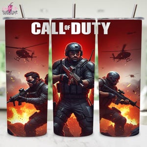 May include: A stainless steel tumbler featuring a design inspired by the video game "Call of Duty." The design includes soldiers, helicopters, and flames, set against a red background. The words "CALL OF DUTY" are prominently displayed.