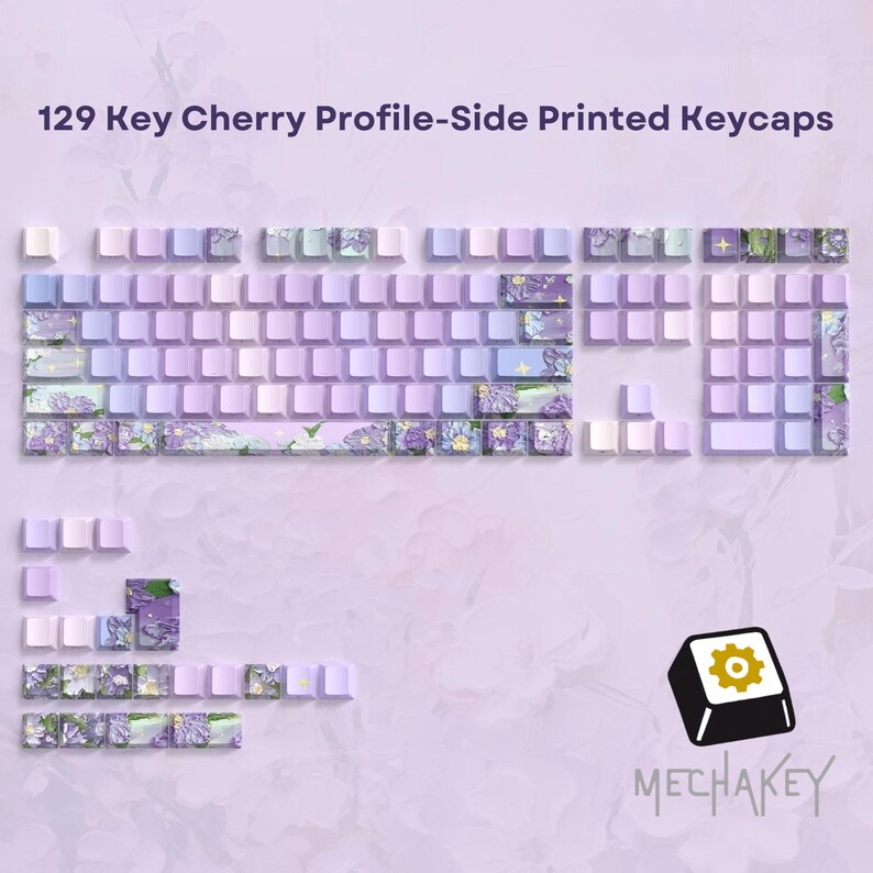 May include: A set of 129 Cherry Profile side-printed keycaps in shades of purple, lavender, and white. Some keycaps feature floral designs. The image includes a logo with a gear icon and the word "MECHAKEY".