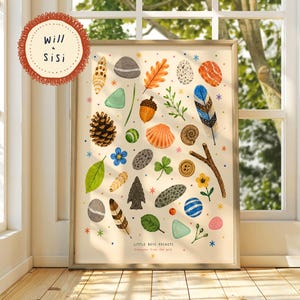 May include: A framed art print titled Little Boys Pockets treasures from the wild featuring illustrations of nature items including a pinecone, acorn, various stones, shells, leaves, feathers, a twig, and a button, accented with small colourful star icons.