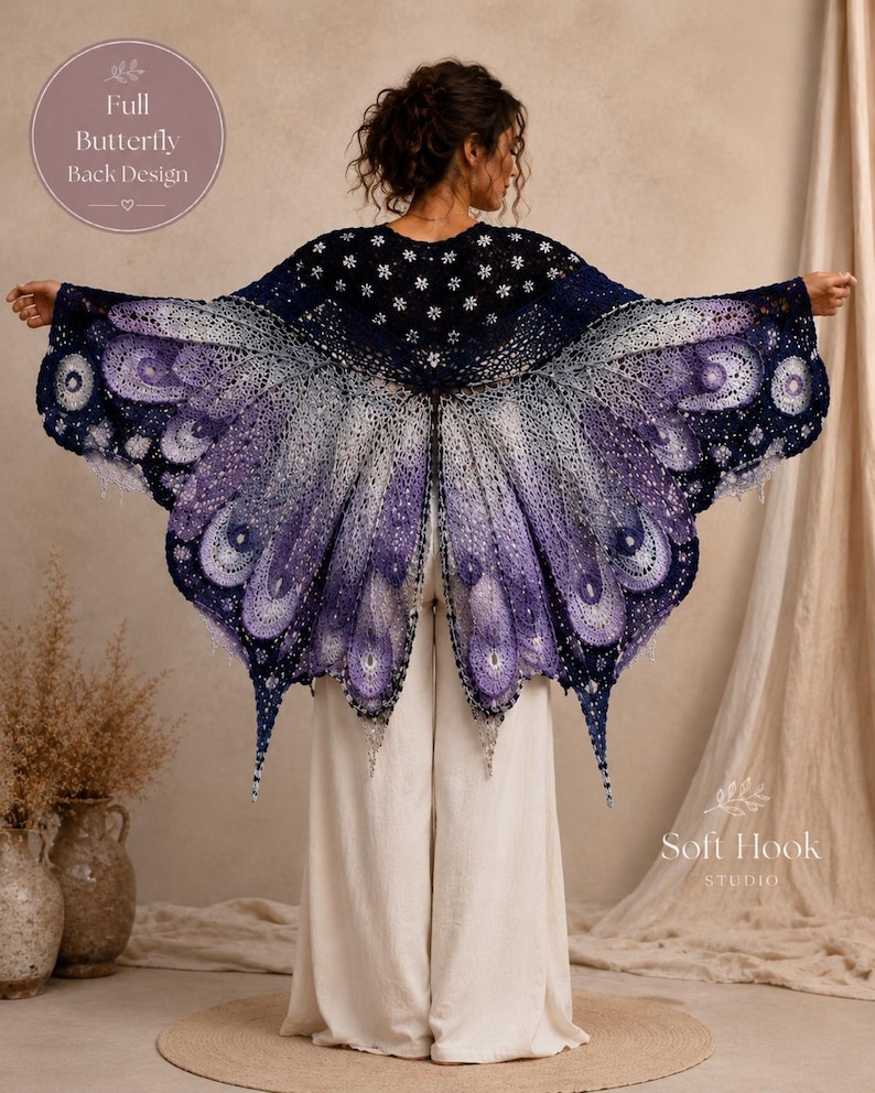 May include: A crochet shawl featuring a butterfly wing design in shades of dark blue, purple, and white. The garment displays intricate lace patterns and scalloped edges. Text on the image reads Full Butterfly Back Design and Soft Hook Studio.