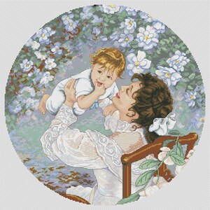 May include: A cross-stitch design featuring a mother holding a baby in a garden setting. The mother wears a white dress with lace details, and the baby is in a white outfit. The background is filled with white and blue flowers.