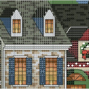 May include: A detailed cross-stitch pattern depicting a village scene with buildings, windows, and rooftops. The color palette includes shades of brown, green, blue, and red, creating a cozy, detailed image. The pattern is ideal for craft enthusiasts.